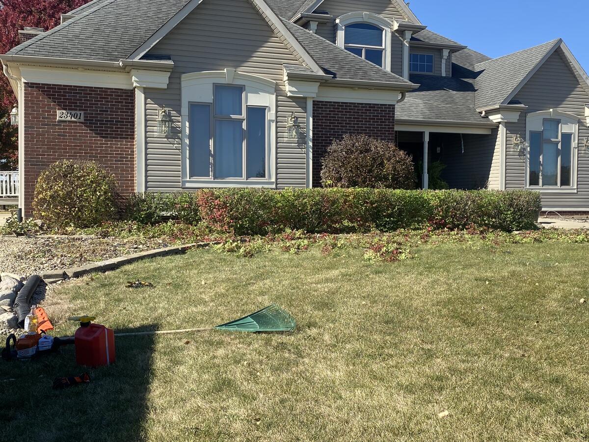 Completed yard makeover project, house with new landscaping